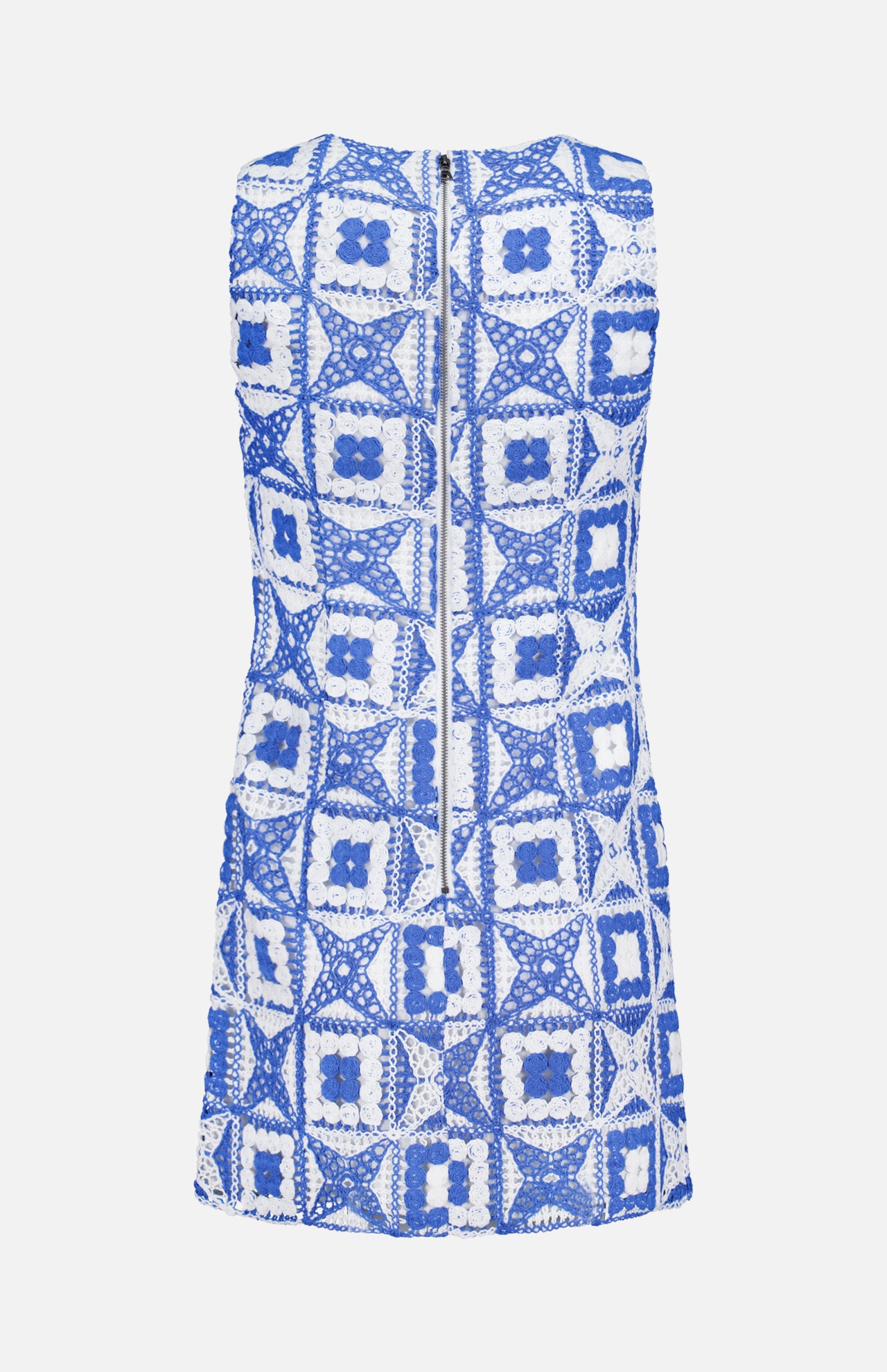 The Clyde A-Line Shift Dress by ALICE + OLIVIA is a sleeveless shift dress showcasing a blue and white crocheted square pattern. Seen from the back, it features a prominent center zipper.