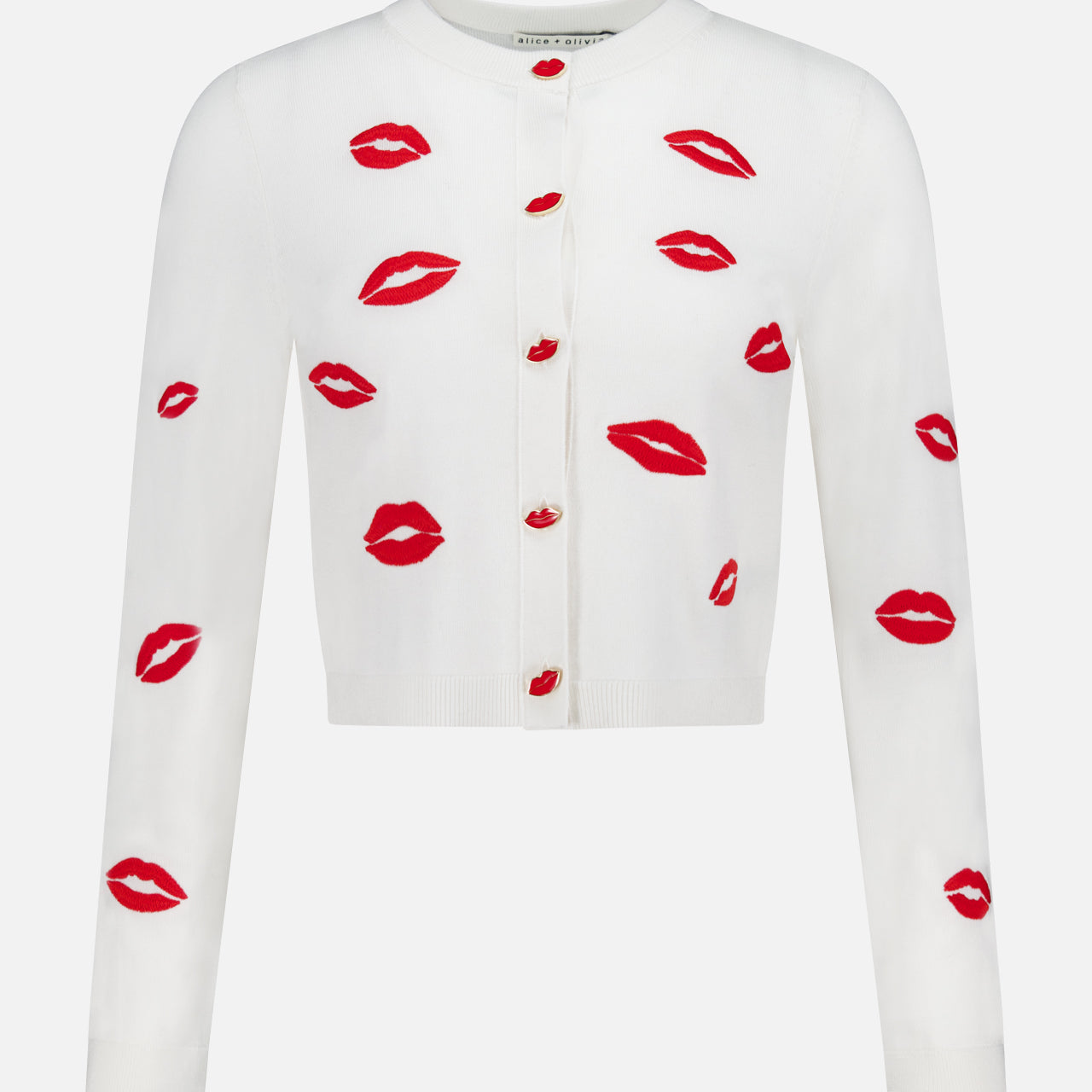 The ALICE + OLIVIA Daroda Lip Cardigan Sweater features long sleeves, red buttons, and playful embroidered red lipstick kiss prints.