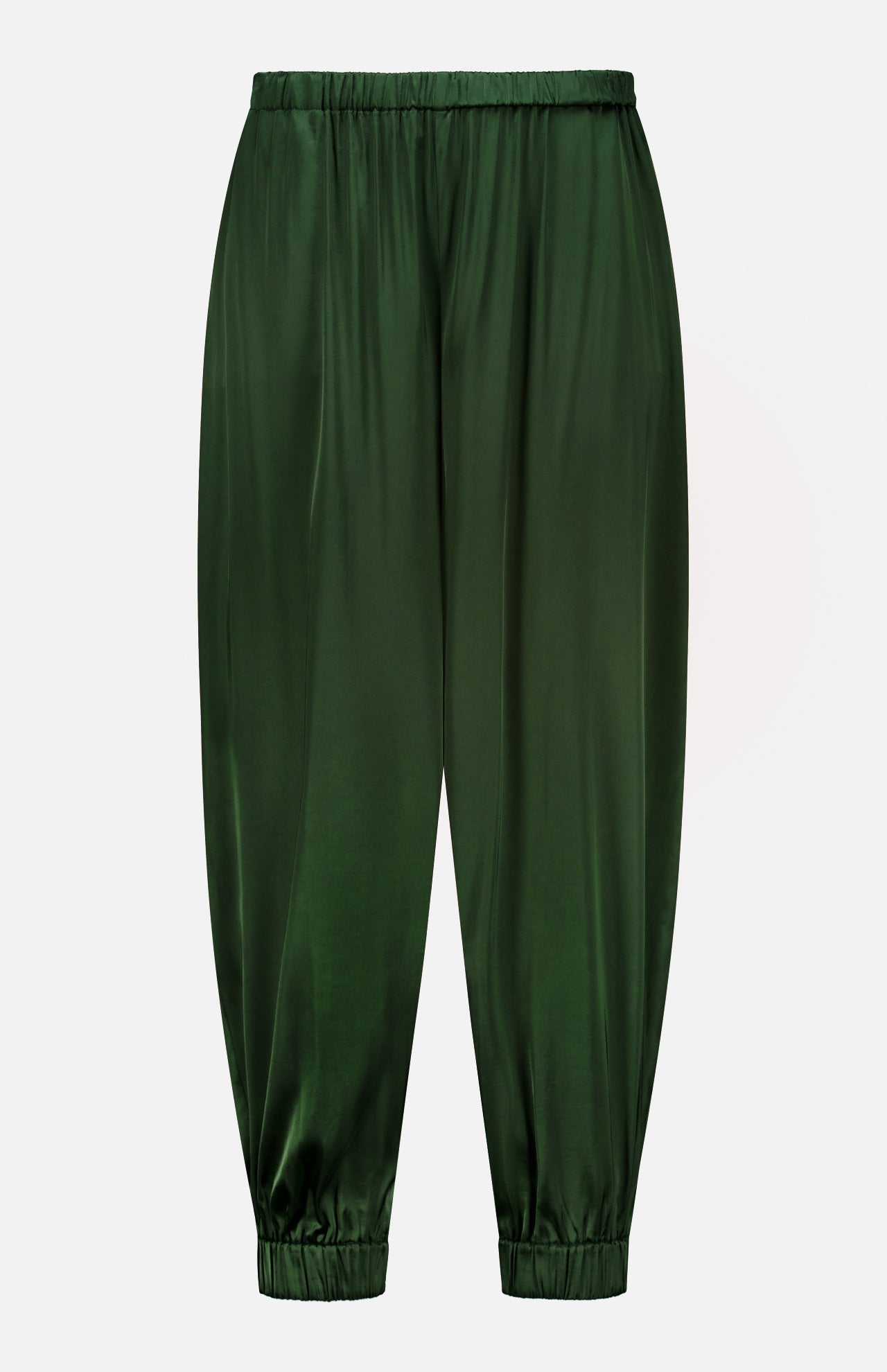 The Declan Pull On Genie Pant by ALICE + OLIVIA is crafted from exceptionally smooth and shiny dark green satin charmeuse, featuring an elastic waistband and elastic cuffs for a classic genie pant silhouette. Shown against a plain white background.