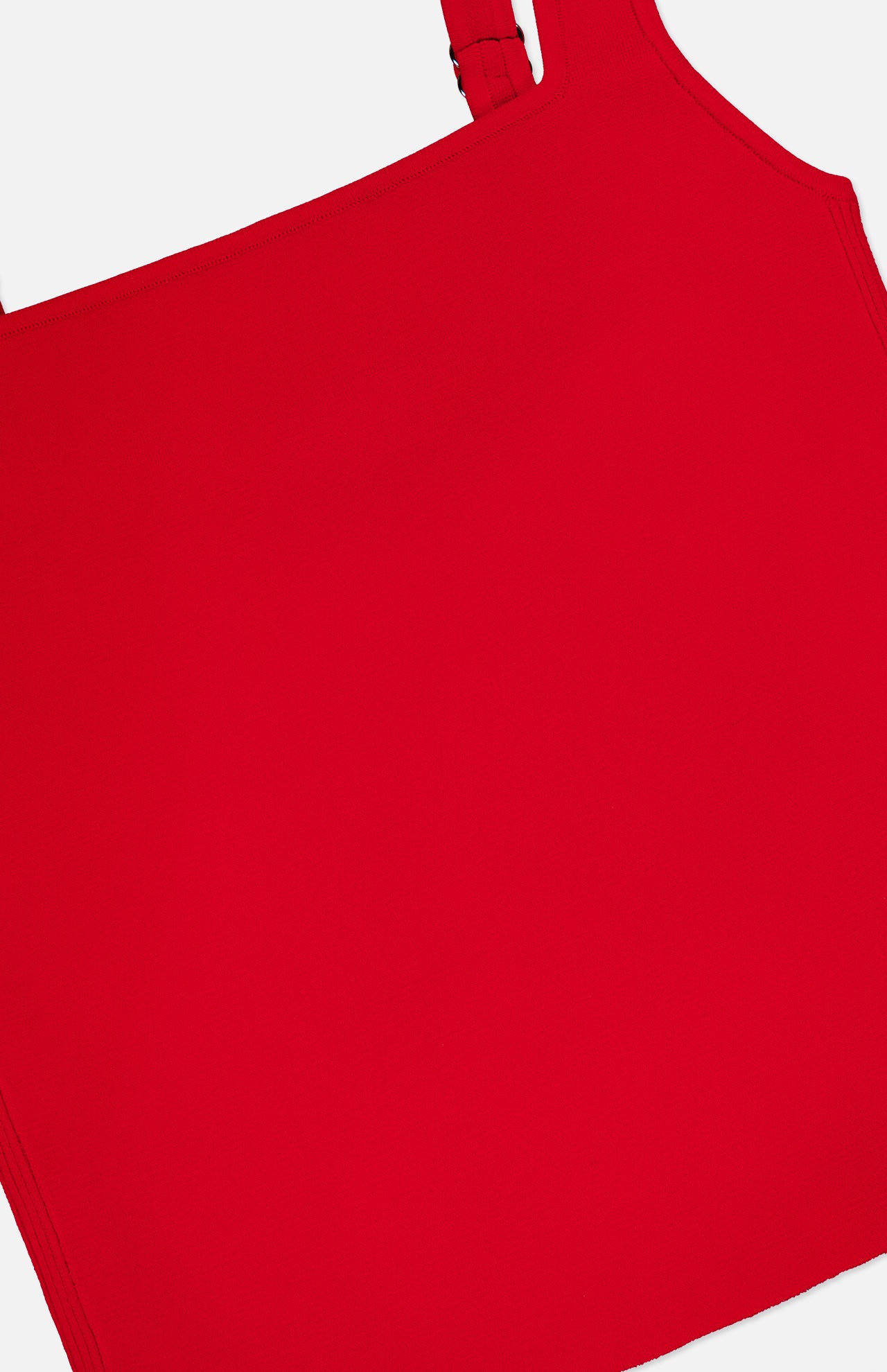Close-up of the ALICE + OLIVIA Devin Side Panel Tank Top in bright red, featuring a square neckline and one visible adjustable strap, set against a white background.