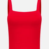 The Devin Side Panel Tank Top by ALICE + OLIVIA is a vibrant red, sleeveless crop top featuring a square neckline and wide shoulder straps, showcased against a plain white background.