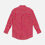 The ALICE + OLIVIA Dimitra Oversized High Low Button Down Shirt features red, white, and blue vertical stripes. Displayed flat with the back facing up against a plain white background.