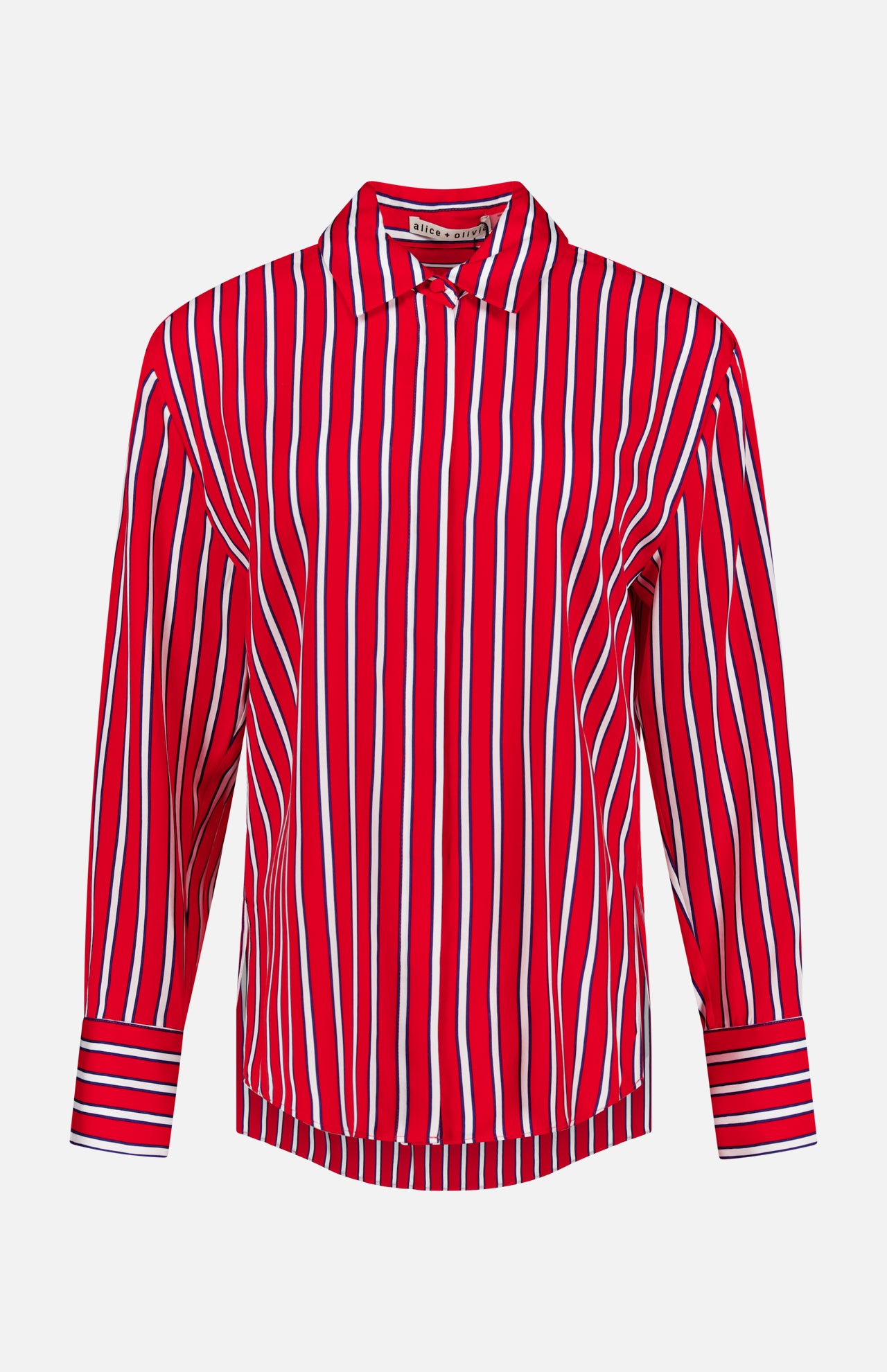 The Dimitra Oversized High Low Button Down Shirt by ALICE + OLIVIA features vertical red, white, and blue stripes, a collar, striped cuffs, and long sleeves. The lightweight silky shirt is shown on a plain white background.