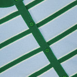 Close-up of the Dollie Striped and Cropped Cardigan by ALICE + OLIVIA, featuring light blue with green and white horizontal stripes, green buttons, and green trim on the button line and collar. The brand label appears at the collar.