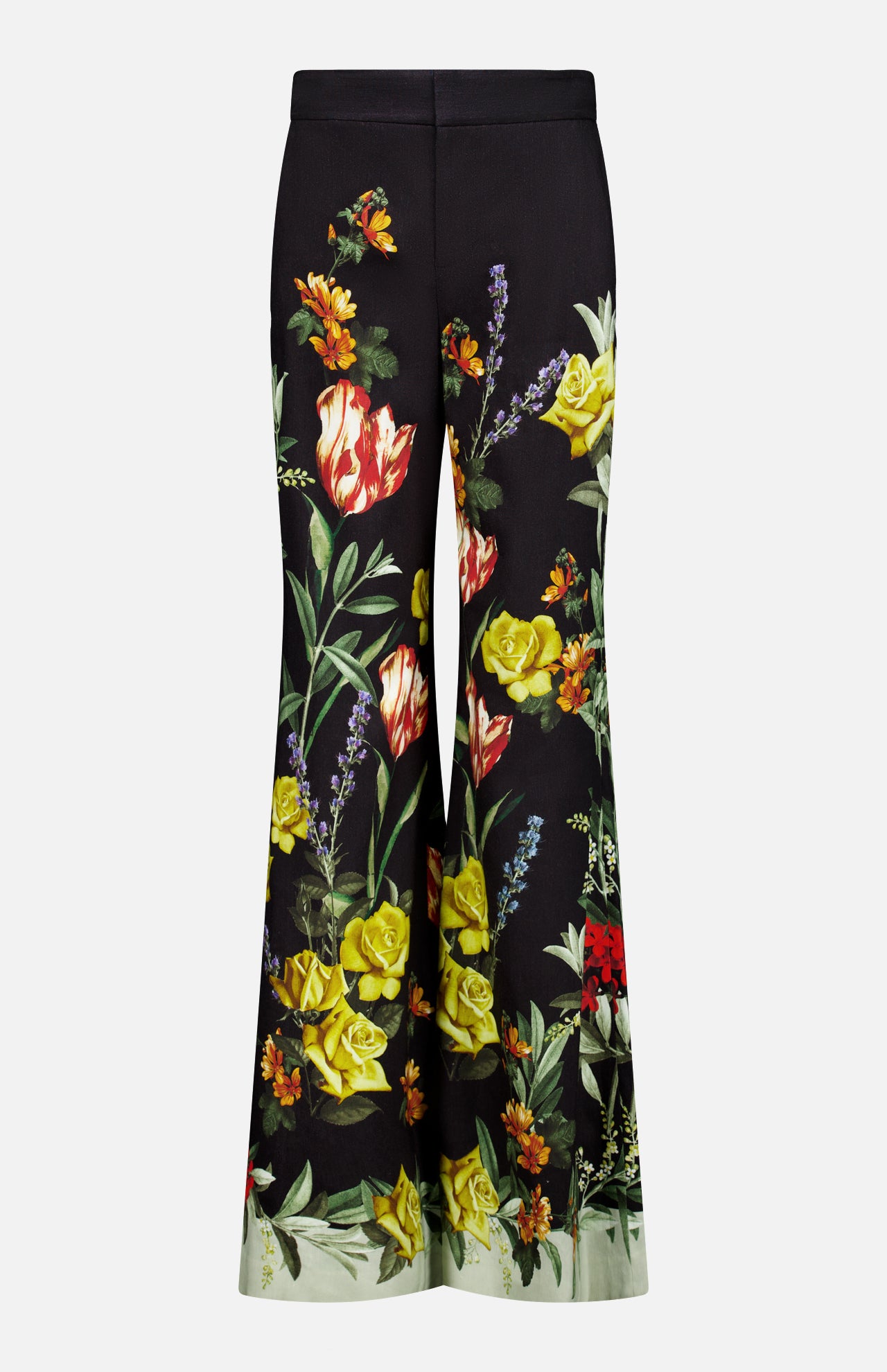 The Dylan High Rise Wide Leg Pant by ALICE + OLIVIA features a black flared silhouette adorned with a vibrant dark floral pattern in red, yellow, and orange flowers with green leaves on both legs, shown against a plain white background.
