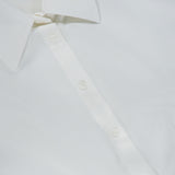 Close-up of the Edle Gathered Corset Button Down Top by ALICE + OLIVIA in off-white, highlighting its collar, buttons, and upper front. The smooth, crisp fabric is accentuated by subtle corset detailing that lends a sophisticated touch to this classic blouse design.