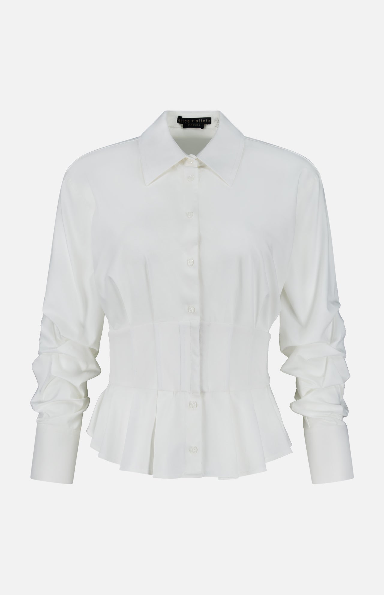 The Edle Gathered Corset Button Down Top by ALICE + OLIVIA features off-white long sleeves, a pointed collar, ruched detailing on the sleeves, and a structured waist that flares into a peplum hem. It is displayed against a plain white background.