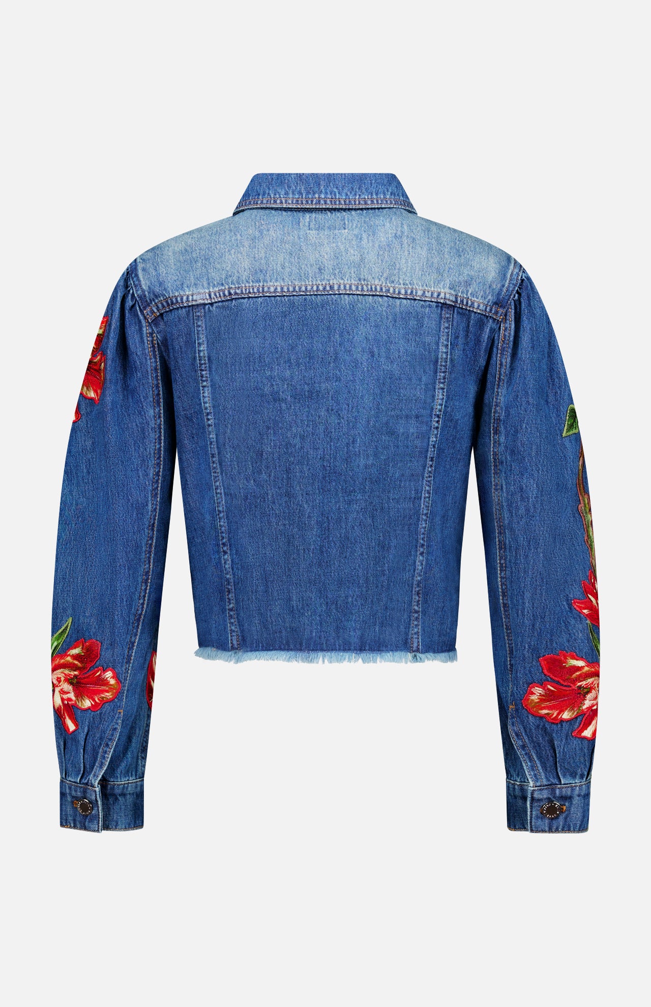 The Elijah Embellished Applique Cropped Denim Jacket by ALICE + OLIVIA is displayed from the back against a plain white background, showcasing its blue denim construction, cropped silhouette with a raw hem, and long sleeves adorned with red embroidered floral appliques.