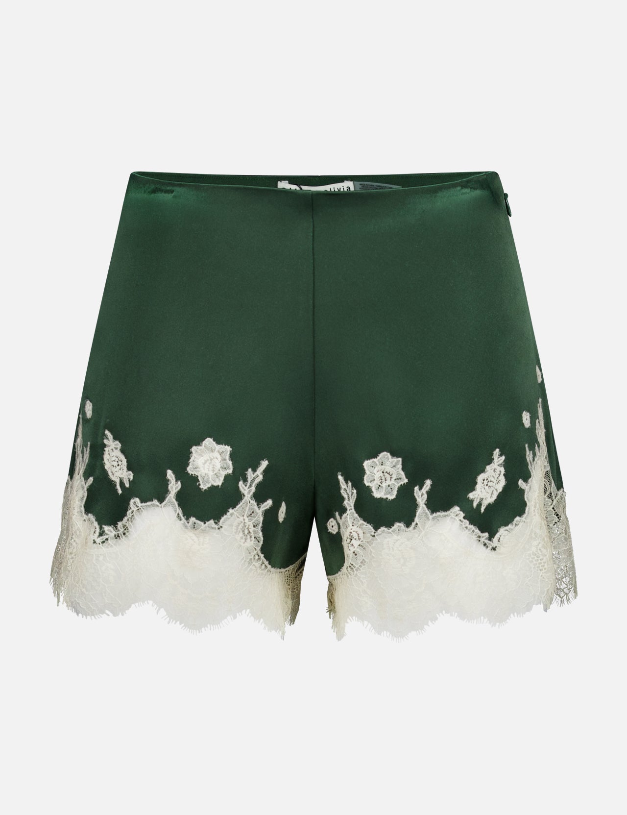 The Elissa Cutaway Lace Short by ALICE + OLIVIA features dark green satin with delicate white lace trim and floral embroidery along the hem, perfect for a summer-in-the-Hamptons look, displayed against a plain white background.