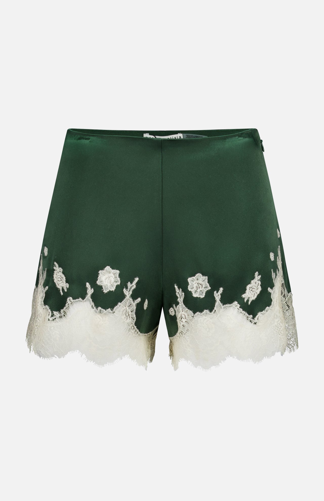 The Elissa Cutaway Lace Short by ALICE + OLIVIA features dark green satin with delicate white lace trim and floral embroidery along the hem, perfect for a summer-in-the-Hamptons look, displayed against a plain white background.