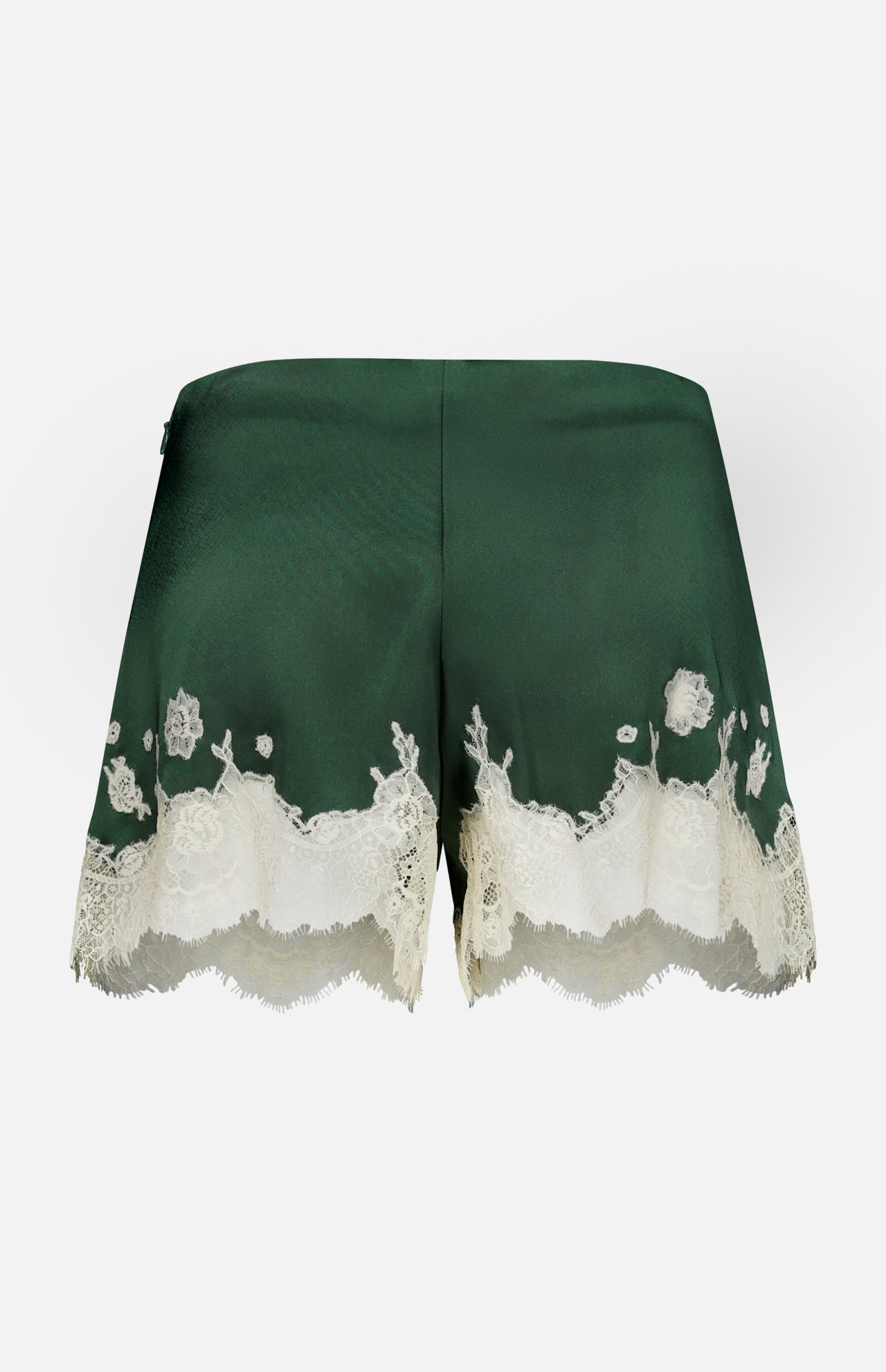Elissa Cutaway Lace Short by ALICE + OLIVIA, featuring dark green satin and elegant bloom cutwork lace trim along the hem, displayed against a plain white background.