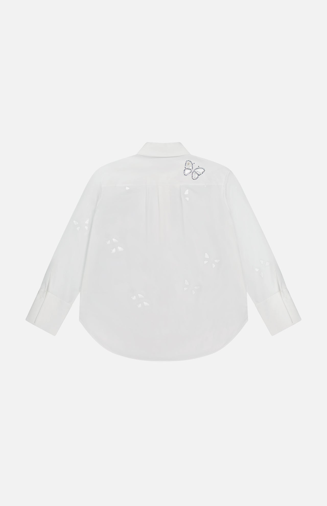 The ALICE + OLIVIA Finely Embellished Button Down with Cutouts is shown from the back, highlighting its delicate butterfly-shaped cut-out patterns and a small embroidered butterfly near the shoulder. These elegant details lend an air of sophistication to this classic white long-sleeve blouse.
