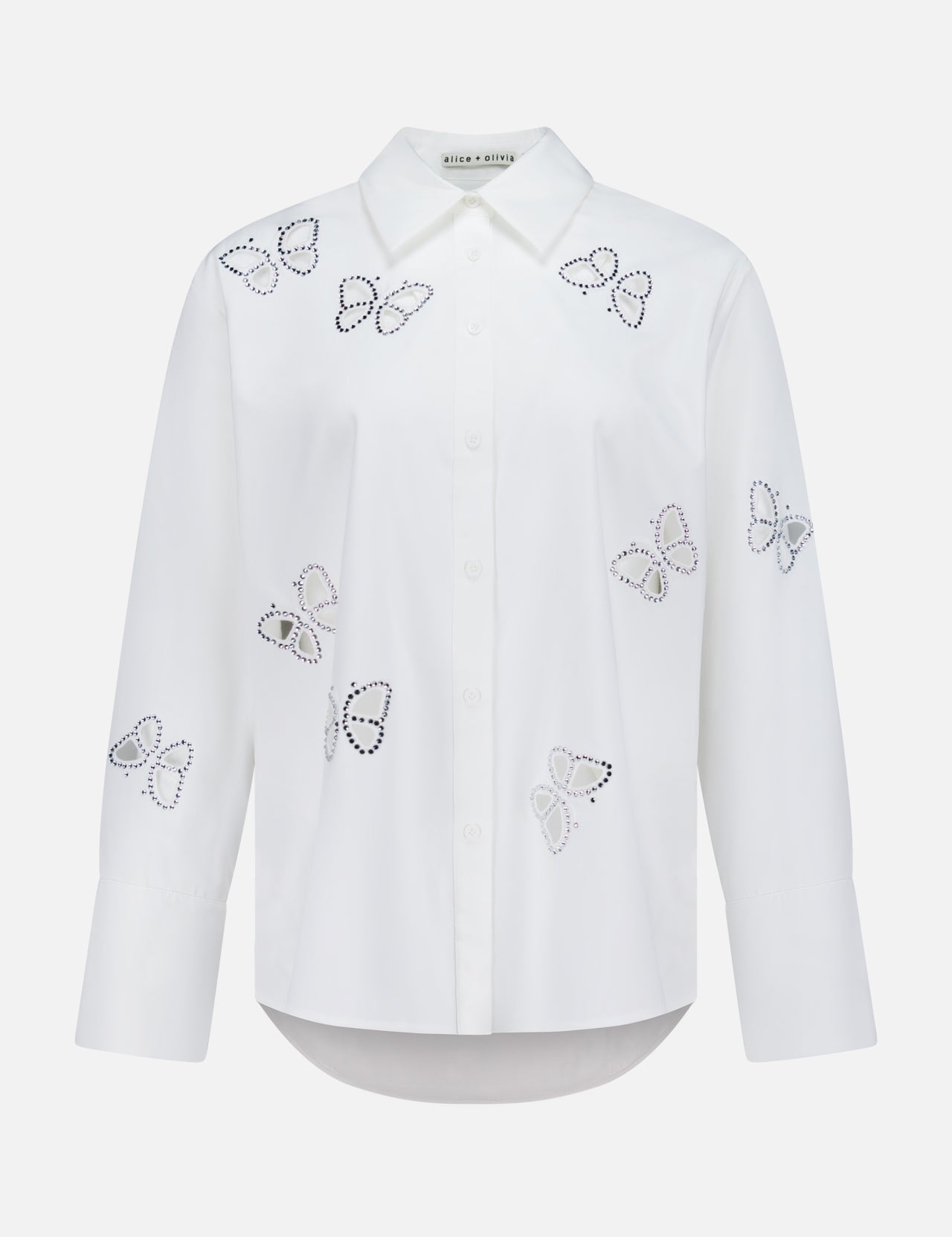 The Finely Embellished Button Down with Cutouts by ALICE + OLIVIA is a sophisticated white long-sleeve blouse with a classic collar and button-up front, featuring scattered butterfly outlines crafted from small black and silver studs across the front, sleeves, and upper chest. Delicate crystal embellishments add an elevated touch of sparkle to this elegant design.