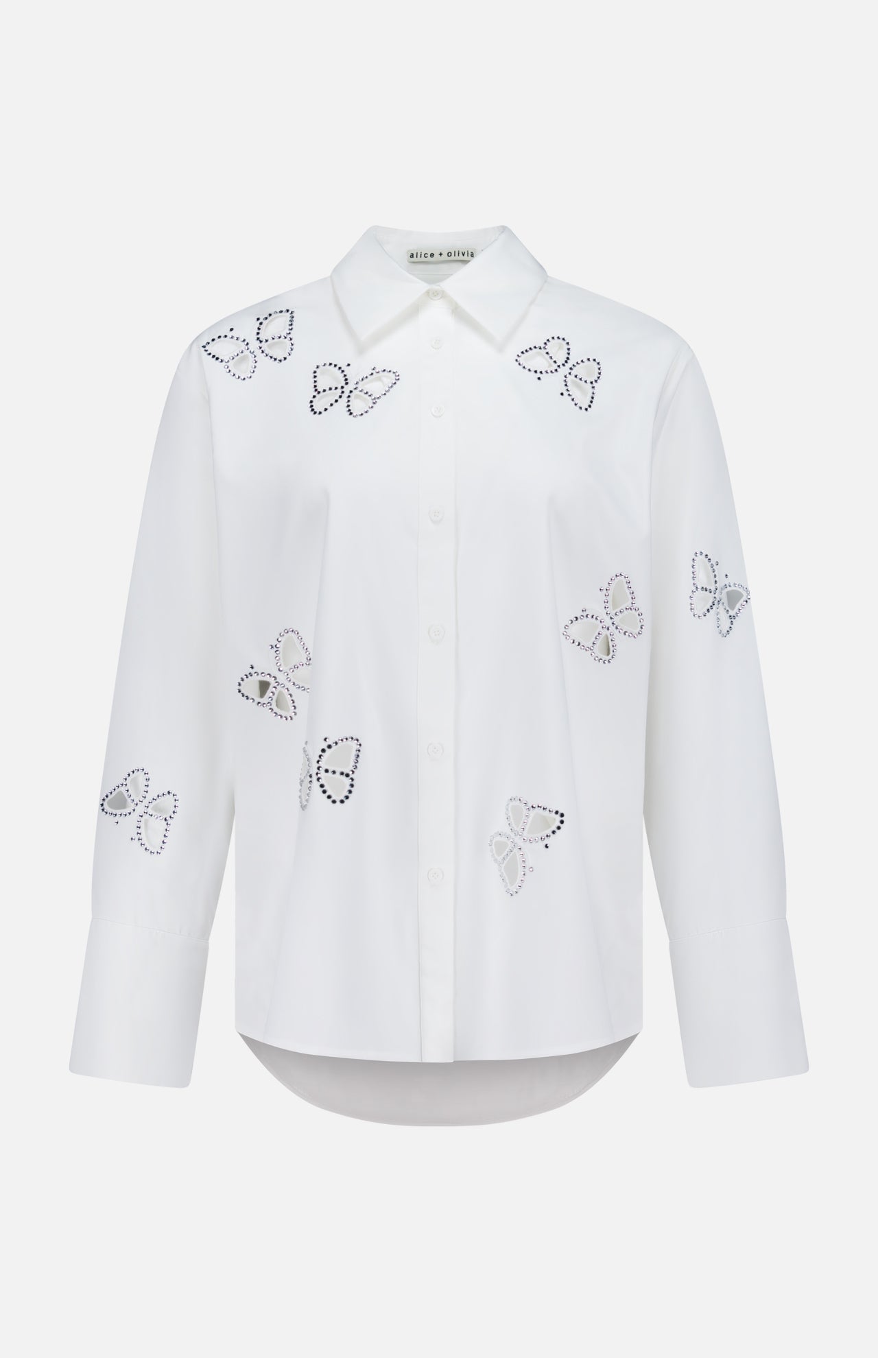 The Finely Embellished Button Down with Cutouts by ALICE + OLIVIA is a sophisticated white long-sleeve blouse with a classic collar and button-up front, featuring scattered butterfly outlines crafted from small black and silver studs across the front, sleeves, and upper chest. Delicate crystal embellishments add an elevated touch of sparkle to this elegant design.