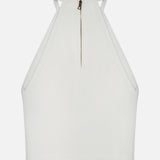 The Heidi Halter Neck Tank Top by ALICE + OLIVIA is a white, sleeveless crop top with a high neckline, textured fabric, and visible back zipper—bringing quiet luxury style and modern simplicity to the classic white tank.