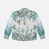 The ALICE + OLIVIA Ilan Pleated Blouson Sleeve Button Front Blouse features a romantic floral print with blue flowers and green leaves on white, pleated long sleeves, a collar, and is shown from the back.