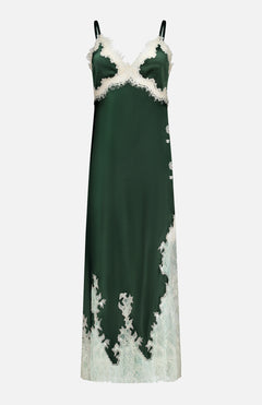The Julietta Cutaway Lace Trim Slip Dress by ALICE + OLIVIA is an elegant emerald dark green satin midi dress, featuring delicate ivory lace trim along the bust, sides, and hem. Designed with thin black shoulder straps, this luxurious slip dress falls to a flattering midi length.