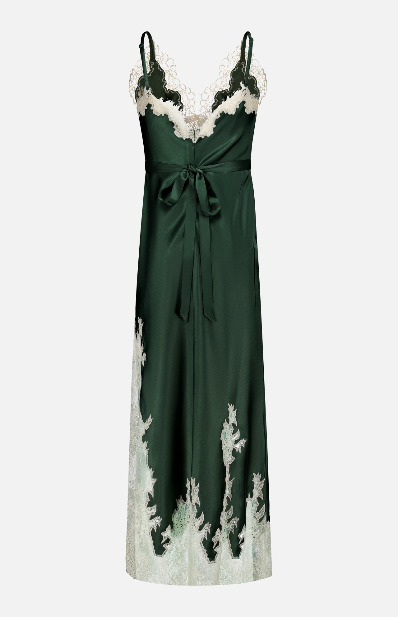 The Julietta Cutaway Lace Trim Slip Dress by ALICE + OLIVIA features a dark green satin fabric with delicate ivory lace along the neckline and hem, spaghetti straps, a V-neckline, and a waist tie. This elegant midi dress showcases a long, flowy silhouette enhanced by its cutaway lace detailing.