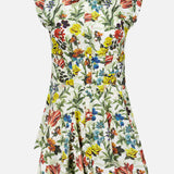 The ALICE + OLIVIA Kim Paneled Corset Flared Mini Shirt Dress is a short-sleeved, collared mini shirt dress crafted from comfortable stretch-cotton, showcasing a pleated skirt and vibrant fall floral print in red, yellow, blue, and green on a crisp white background.