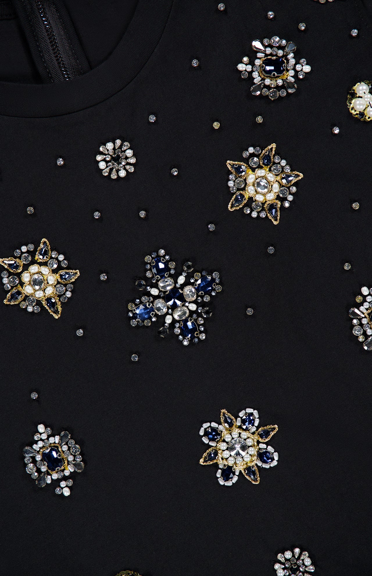 Close-up of the ALICE + OLIVIA Micah Embellished Muscle T-shirt in black, adorned with detailed gold, silver, and blue beaded floral patterns, featuring sparkling beads, sequins, and crystal accents.