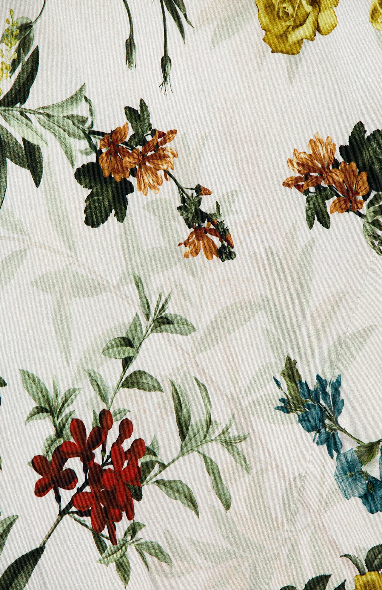 The Montana Slim Strappy Back Maxi Dress by ALICE + OLIVIA showcases an intricate, botanical patterned fabric adorned with colorful red, yellow, orange, and blue flowers and green leaves on a white background. This vibrant and elegant design makes it perfect for crafting a stunning floral maxi dress.