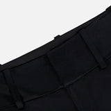 Close-up of the waistband and belt loops of the Olivia Pant with Cutaway Lace Godet by ALICE + OLIVIA, in black. The tailored fabric features a clean seam, structured fit, and smooth finish against a white background.