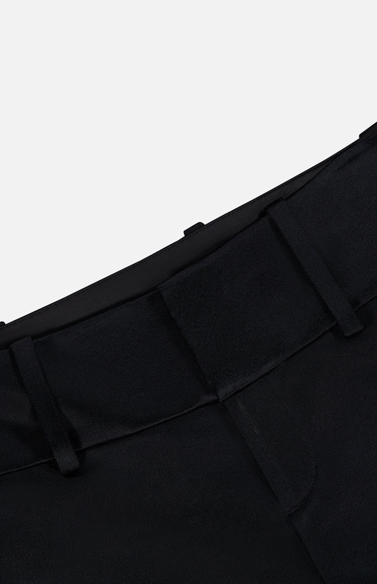 Close-up of the waistband and belt loops of the Olivia Pant with Cutaway Lace Godet by ALICE + OLIVIA, in black. The tailored fabric features a clean seam, structured fit, and smooth finish against a white background.