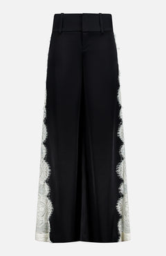 Olivia Pant with Cutaway Lace Godet by ALICE + OLIVIA: wide-leg black trousers with a high waist, belt loops, and cutwork lace trim down each outer side, shown on a plain white background.