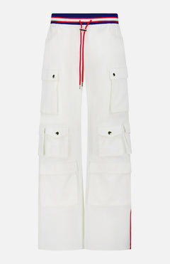 The ALICE + OLIVIA Olympia Mr Baggy Cargo Pant With Side Stripe features a relaxed wide-leg fit, six flap pockets, red drawstring, and a striped waistband in red, blue, and white for a sporty look.