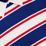 A close-up of the ALICE + OLIVIA Poria Removable Cuffs and Collar Sweater in blue, white, and red stripes, layered over a white shirt with thin red stripes; only the detachable collar and part of the shirt are visible above the sweater.