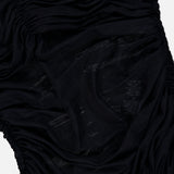 Close-up of black ruched mesh fabric with semi-sheer sections, softly gathered and draped to showcase detailed texture and stitching—part of the Renee Sheer Soft V-Neck Ruched Tank Bodysuit by ALICE + OLIVIA.