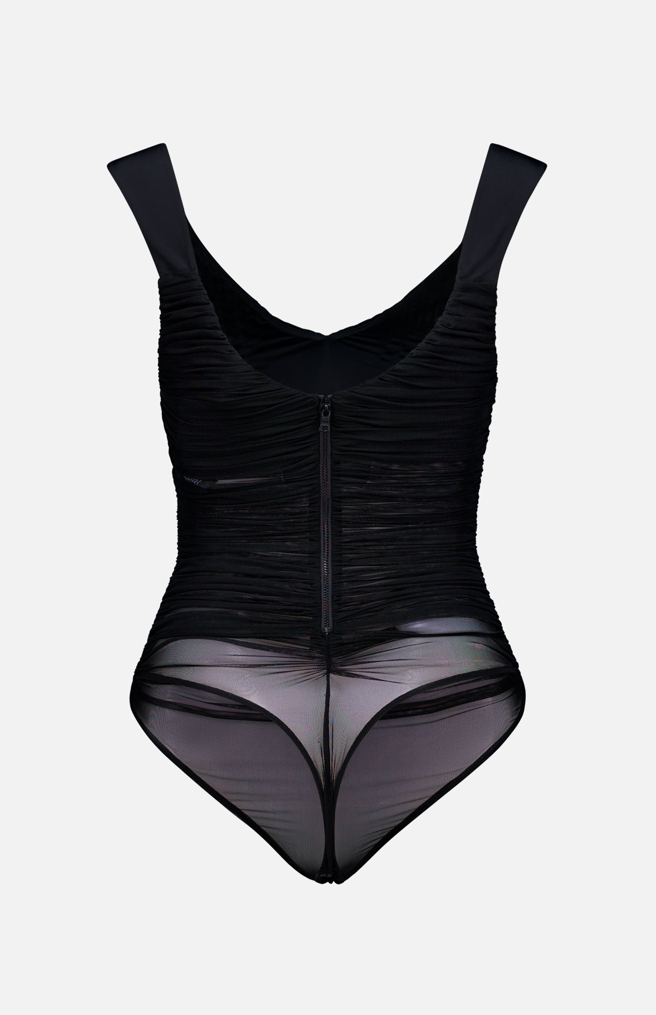The ALICE + OLIVIA Renee Sheer Soft V-Neck Ruched Tank Bodysuit features wide straps, a front zipper, and sheer ruched mesh panels around the hips and lower abdomen, with a flattering thong back—shown against a plain white background.