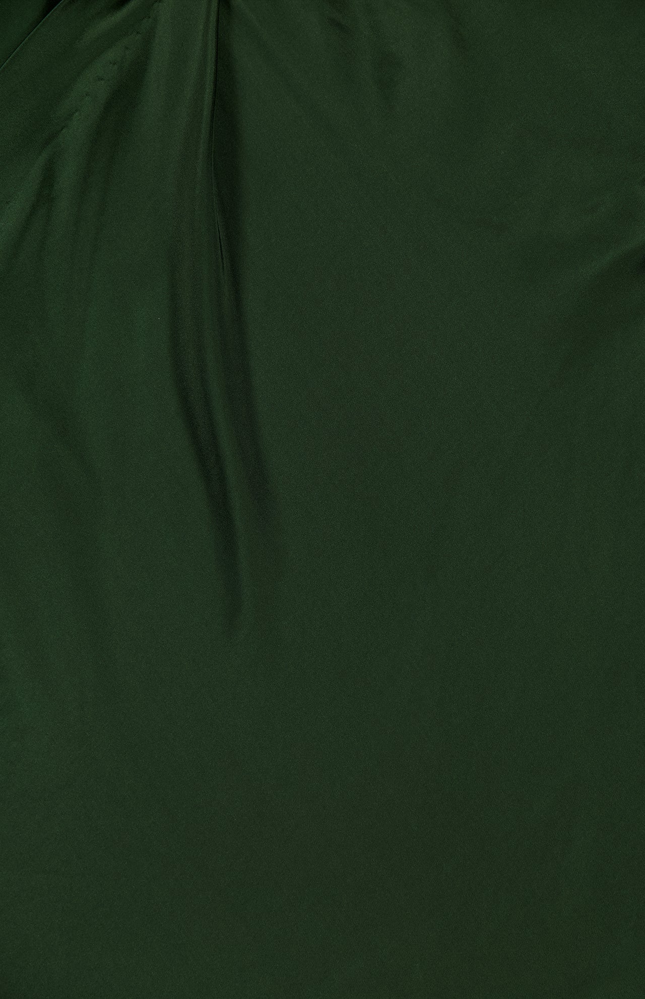 Close-up of the ALICE + OLIVIA Rita Draped Cropped Top with Scarf in dark green silk charmeuse, featuring gentle folds and creases that create subtle shadows and a textured effect across its smooth surface.