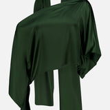 The ALICE + OLIVIA Rita Draped Cropped Top with Scarf, crafted from luxurious dark green silk charmeuse, is elegantly displayed on a mannequin in an asymmetrical, modern off-the-shoulder style against a plain white background.
