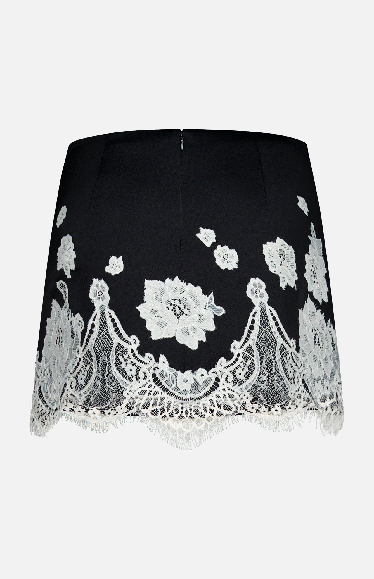 The Rubi Lace Trim Low Rise Micro Skirt by ALICE + OLIVIA features white floral cutwork lace trim, a scalloped hem, and a low rise fit, shown against a plain white background.