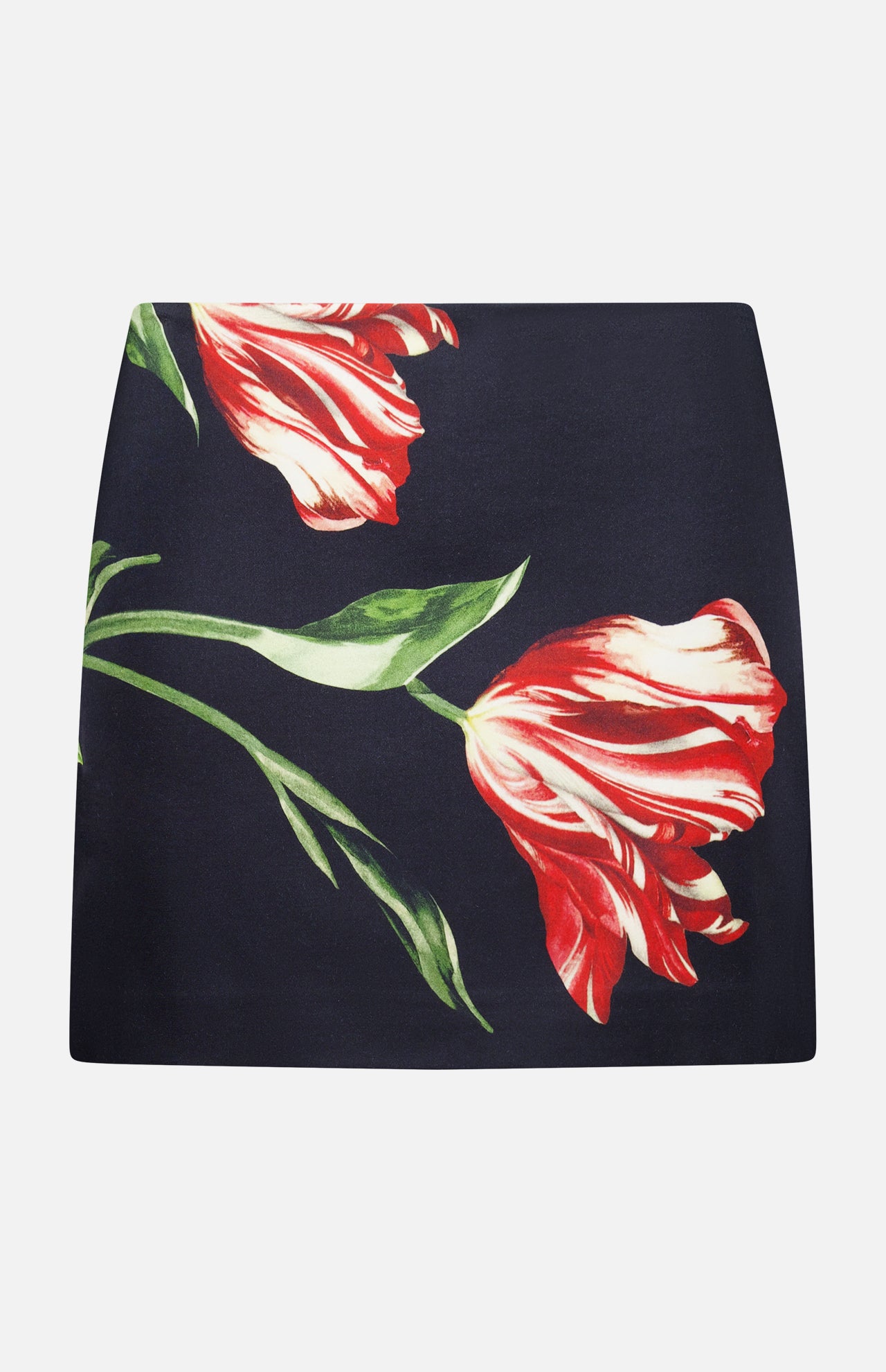 The ALICE + OLIVIA Rubi Low Rise Floral Skirt showcases a striking large red and white tulip print with vivid green leaves on a black mini silhouette, displayed flat against a white background—an ideal piece to bring romantic flair to your wardrobe.