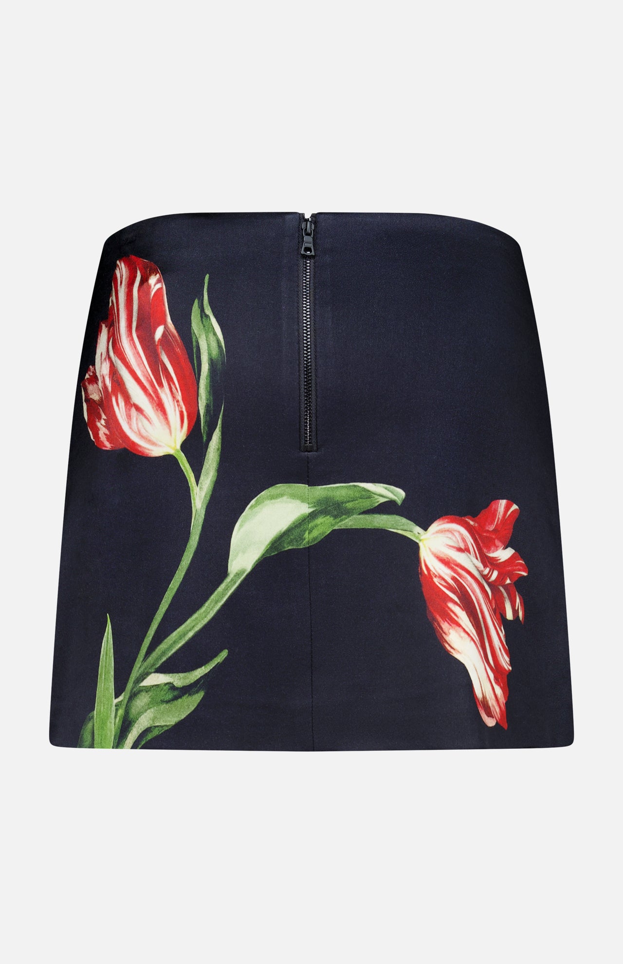 The Rubi Low Rise Floral Skirt by ALICE + OLIVIA is a black mini skirt adorned with a striking red and white tulip print and green stems, finished with a visible back zipper. This romantic piece seamlessly blends elegance with a playful flair.