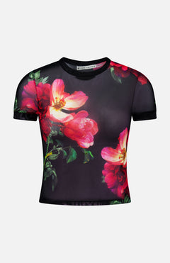 The Tess Crewneck Mesh T-shirt by ALICE + OLIVIA is a short-sleeved, sheer black cropped top with vibrant pink and red floral prints and green leaves, featuring a printed mesh design and branded collar.