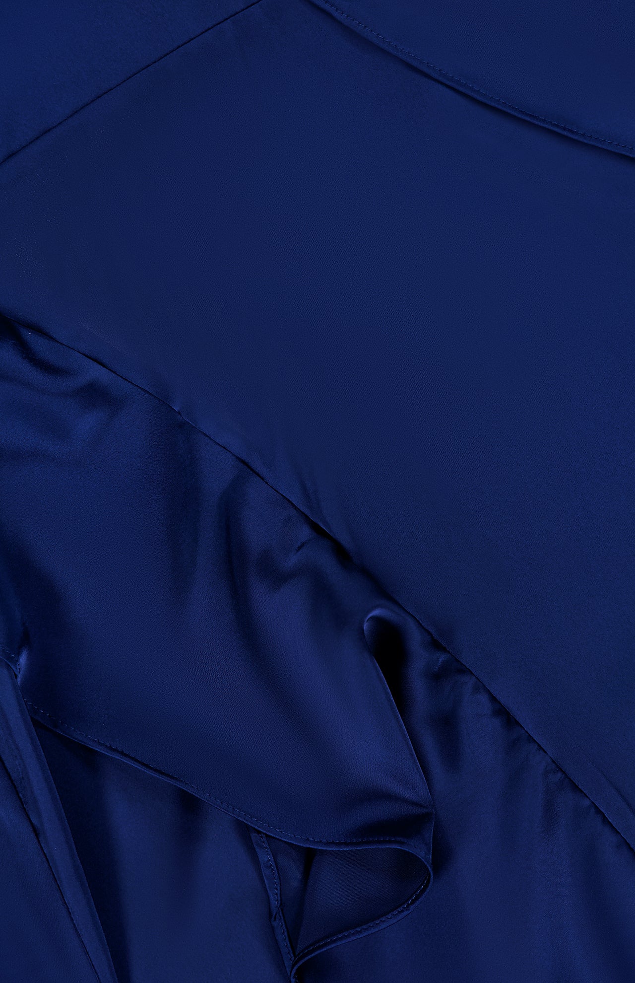 Close-up of smooth, dark blue satin fabric with flowing folds—ideal for crafting the Alessandra Ruffle Maxi Dress by AMANDA UPRICHARD, featuring a graceful halter neckline perfect for any special occasion.