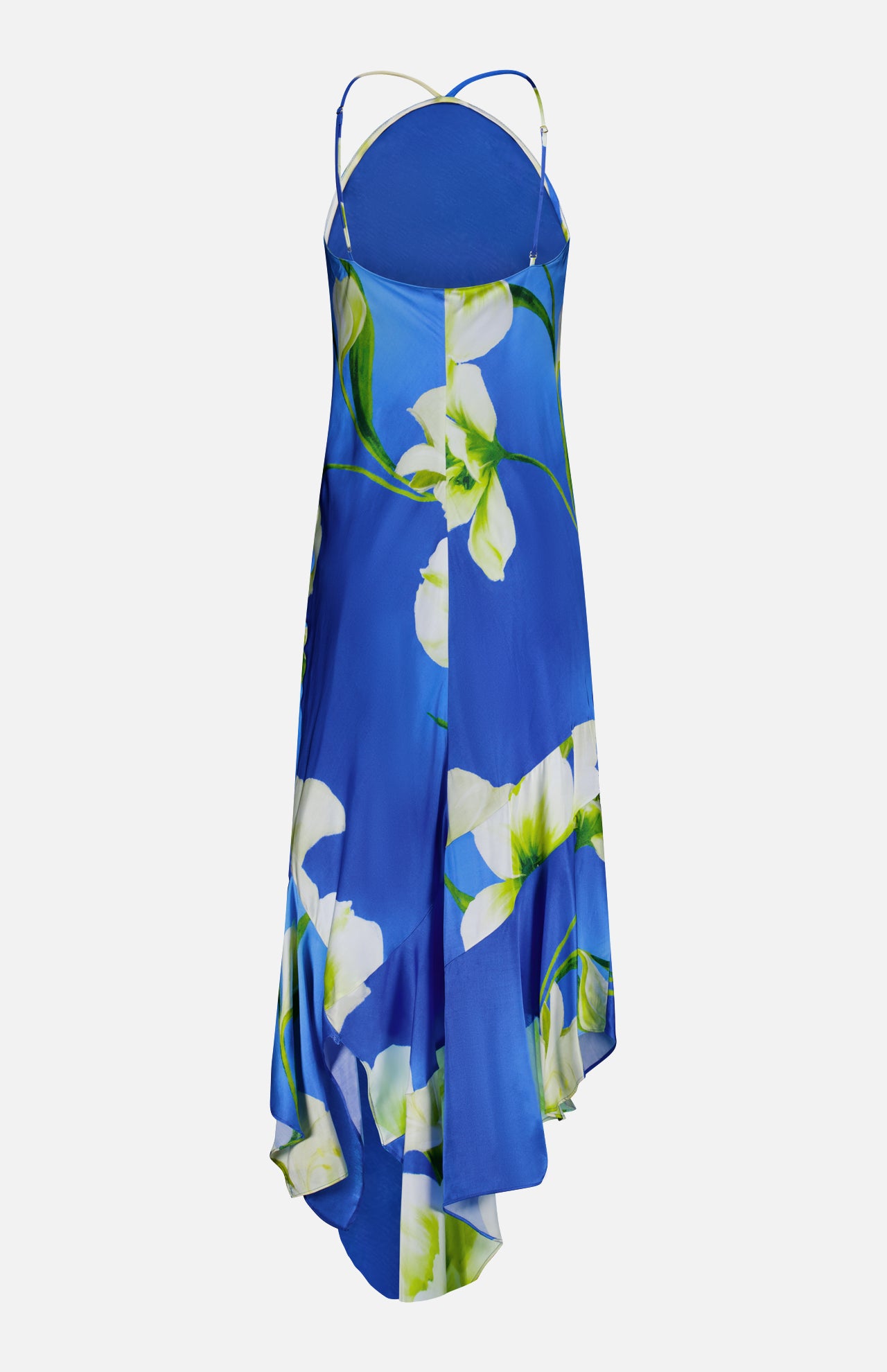 The Gabriella Floral Midi Dress by AMANDA UPRICHARD features thin straps, an asymmetrical hem, and a white and green floral print on blue. Shown against a white background.