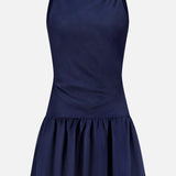 The AMANDA UPRICHARD Margo Drop Waist Skirt Dress is a sleeveless navy linen organza mini dress with a fitted bodice and dropped waist, featuring a gathered flared skirt. Shown against a plain white background.