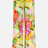 The Mariko Wide Leg Floral Pants by AMANDA UPRICHARD feature a vibrant multicolored floral print and relaxed fit, finished with red, white, and black striped trim at the hem.