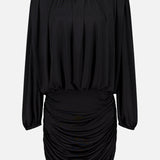 The Martha Ruched Mini Dress by AMANDA UPRICHARD is a black, long-sleeved mini dress crafted from soft jersey knit fabric. It features a gathered neckline and a fitted, ruched skirt for a sophisticated yet alluring silhouette. Displayed on a plain white background, this sexy LBD is the perfect choice for your next night out.