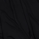 Experience the Martha Ruched Mini Dress by AMANDA UPRICHARD—crafted from smooth black fabric with soft, draped folds and gentle shadows for a flowing texture. The perfect sexy LBD to flatter every curve.