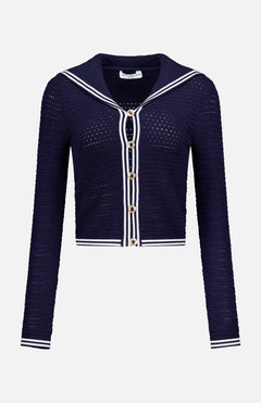 The Monique Sailor Neckline Cardigan by AMANDA UPRICHARD features a navy crochet-knit, long sleeves, white stripe trim, gold front buttons, and a sailor-inspired neckline, shown against a plain white background.