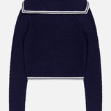 The Monique Sailor Neckline Cardigan by AMANDA UPRICHARD is a navy blue long-sleeve knit with a wide sailor neckline and white striped trim, shown on a plain white background.