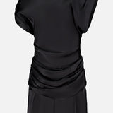 The Olandria Waist Bustle Mini Dress by AMANDA UPRICHARD—a black satin short-sleeve dress featuring a draped, ruched design around the waist and hips reminiscent of cocktail party elegance—displayed against a plain white background.