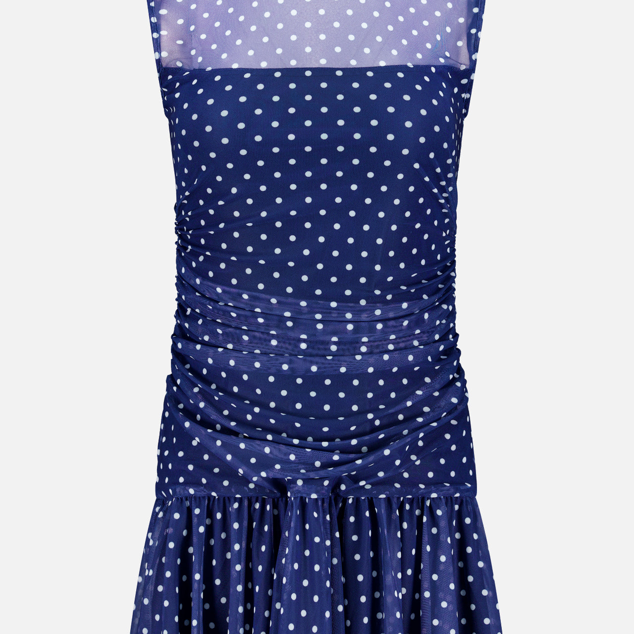 The Rumi Sleeveless Polka Dot Dress by AMANDA UPRICHARD features a navy blue print, high sheer neckline, ruched sides, and flared ruffled skirt—an effortlessly chic mini dress for any occasion.