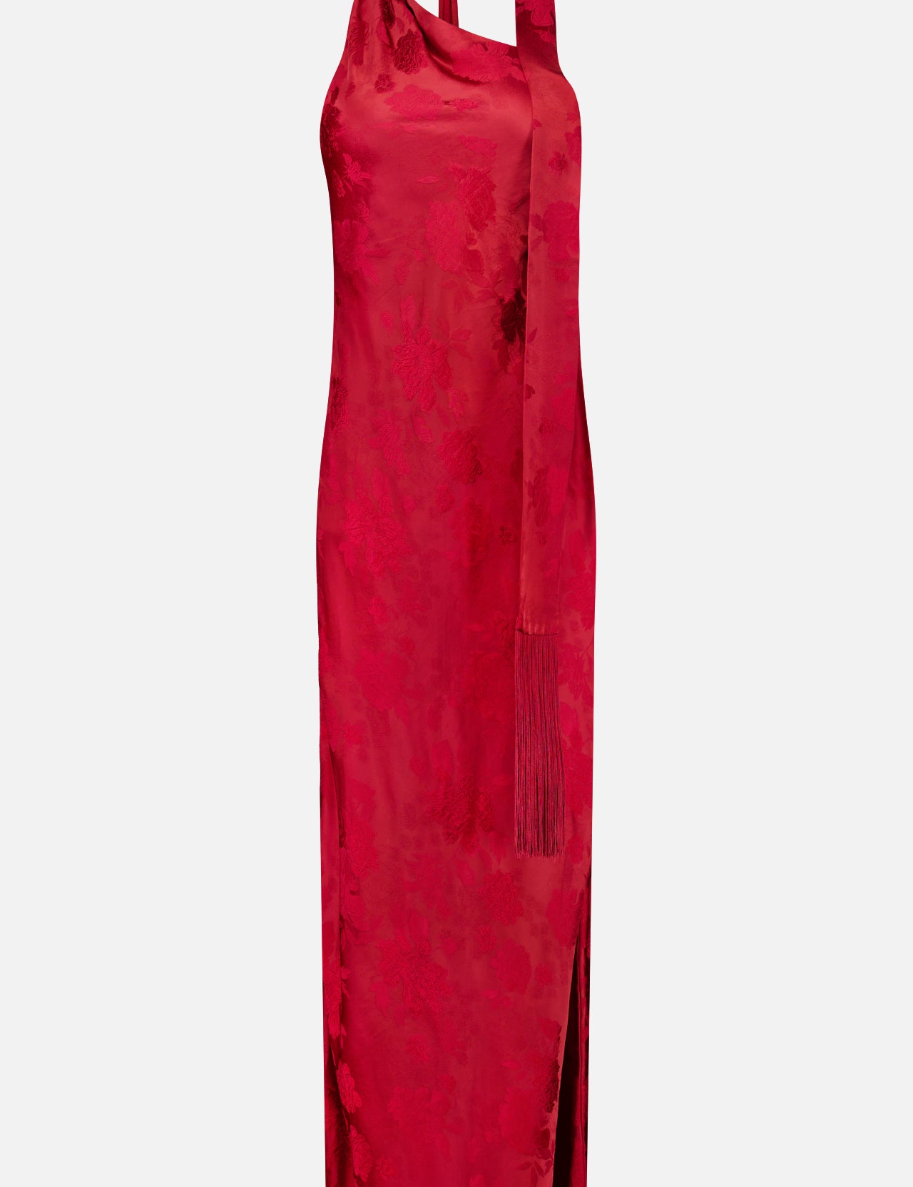 The Sonya Fringed Maxi Dress by AMANDA UPRICHARD is a sleeveless, dark red satin floral jacquard dress with a subtle pattern, high neckline, and a matching long scarf draped over one shoulder. This elegant maxi dress features a side slit and a fitted, ankle-length silhouette.