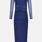 The Zoey Polka Dot Midi Dress by AMANDA UPRICHARD features navy mesh, long sheer sleeves, white polka dots, ruched waist detailing, and a keyhole neckline opening.